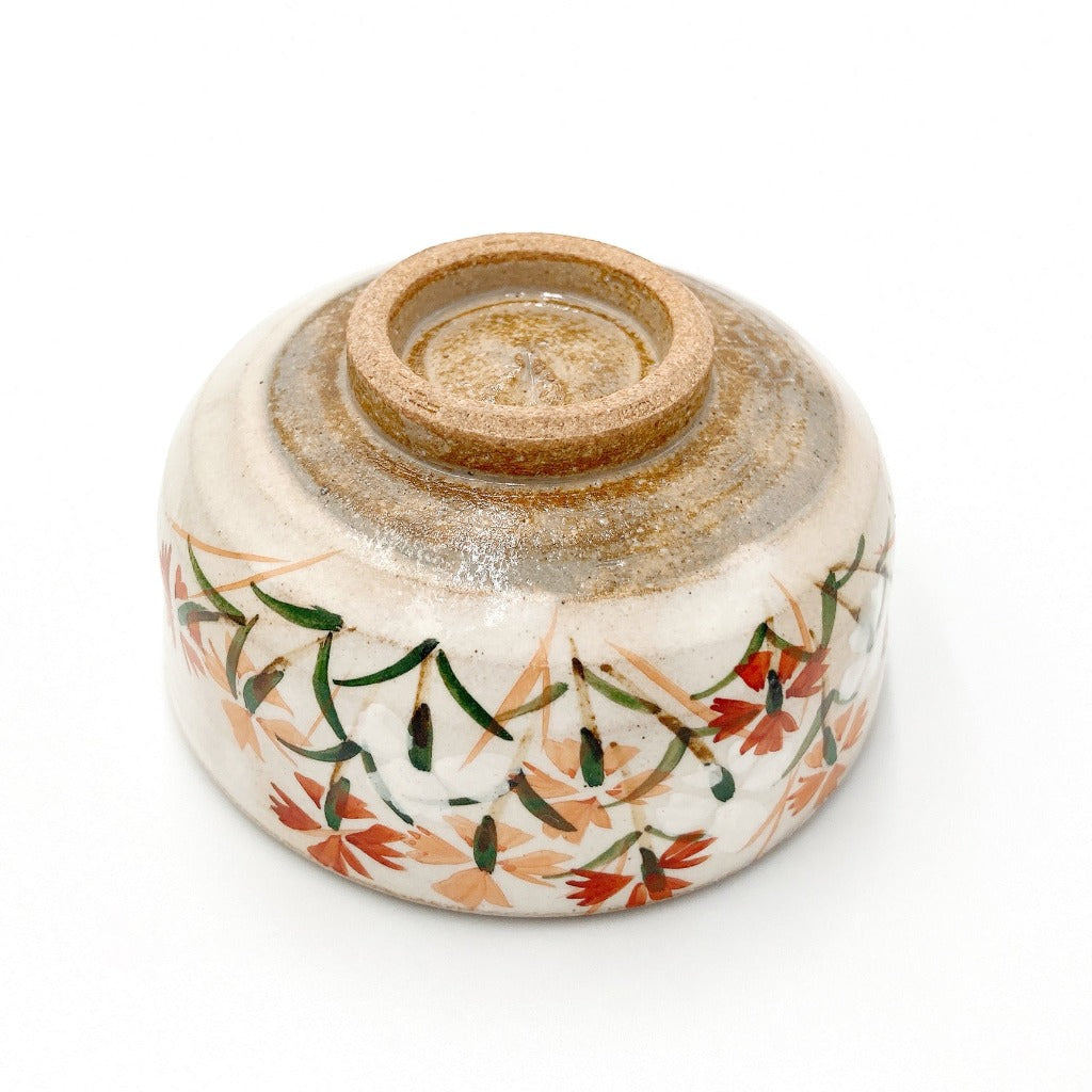 View of base of Shunzan Mori Nadeshko Sake Cup decorated with caryophyllaceae flowers.