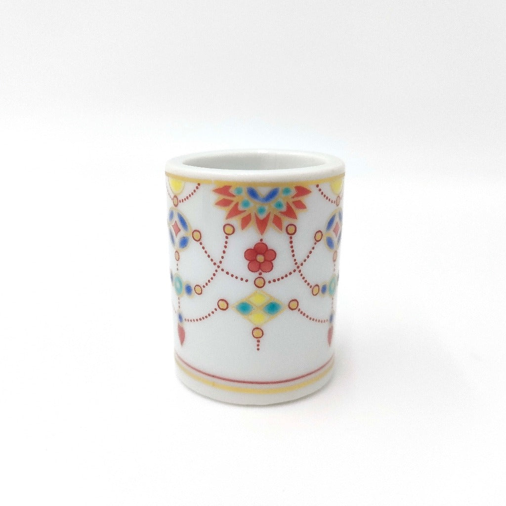 side view of Kutani Yaki Toothbrush Holder showing yorakumon design