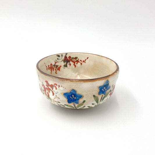 top down shallow angled view of Shunzan Mori ceramic Kikyō Sake Cup showing blue floral pattern