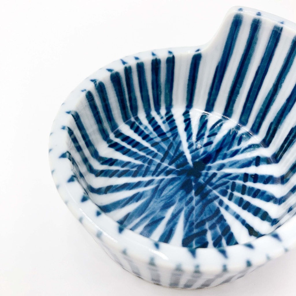 top down angled close up view of ceramic blue and white striped Togusa Condiment Holder