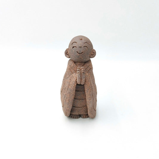 front view of unglazed ceramic Jizo Figurine