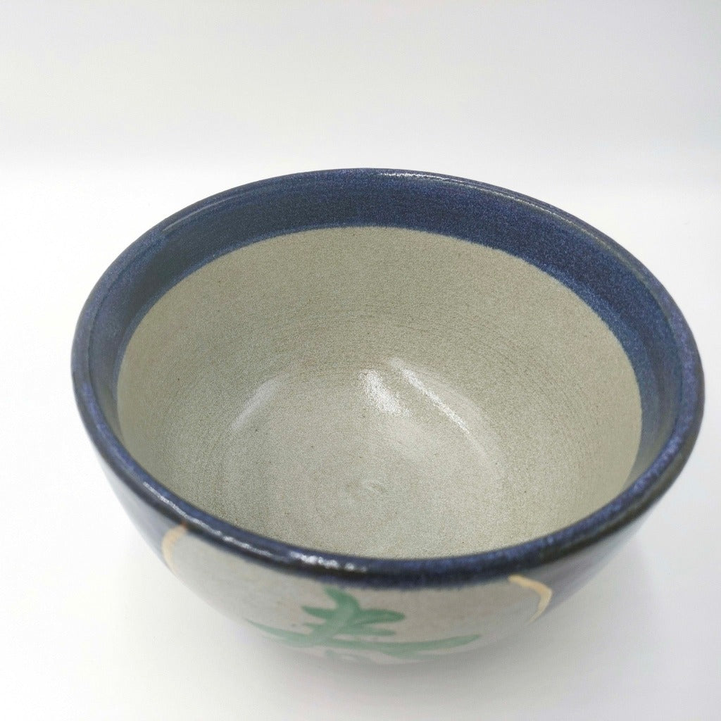 top down view of ceramic Shunka-Shuto Donburi bowl showing glazed light grey interior with blue rim