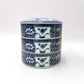side view of blue ceramic Three Tiered Jūbako displaying intricate floral pattern