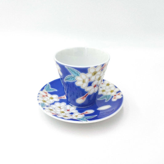 top down angled view showing blue floral ceramic Patterned espresso cup and saucer