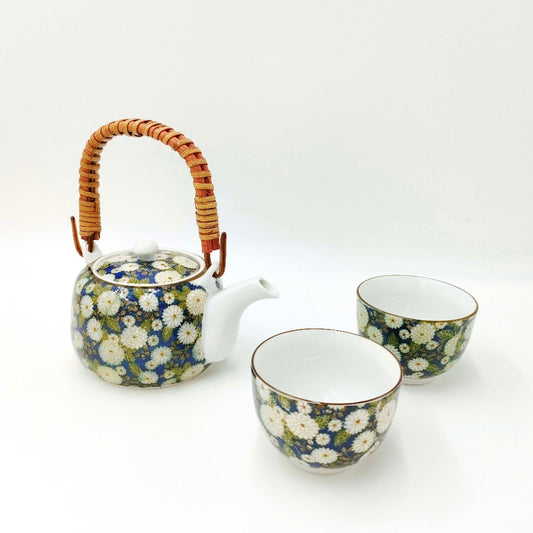 top down angled view of Dark Blue Floral Uwade Kyūsu Teapot with two matching cups