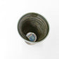 top down view of ceramic Tenmoku Cup with oil drop glaze showing its uniquely shaped interior