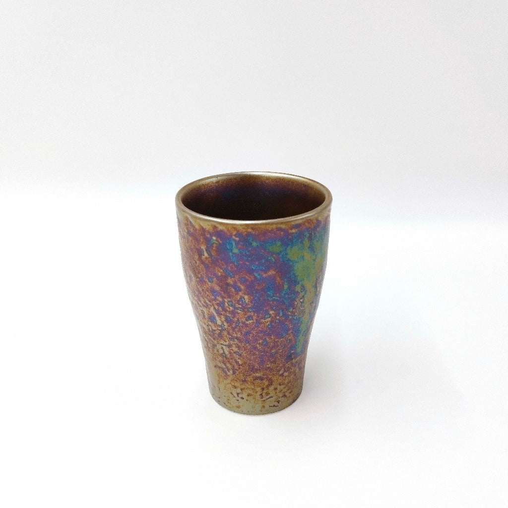 slightly angled view of ceramic Tenmoku Cup with oil drop glaze finish