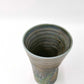 top down angled view of ceramic Tenmoku Cup with oil drop glaze showing its interior