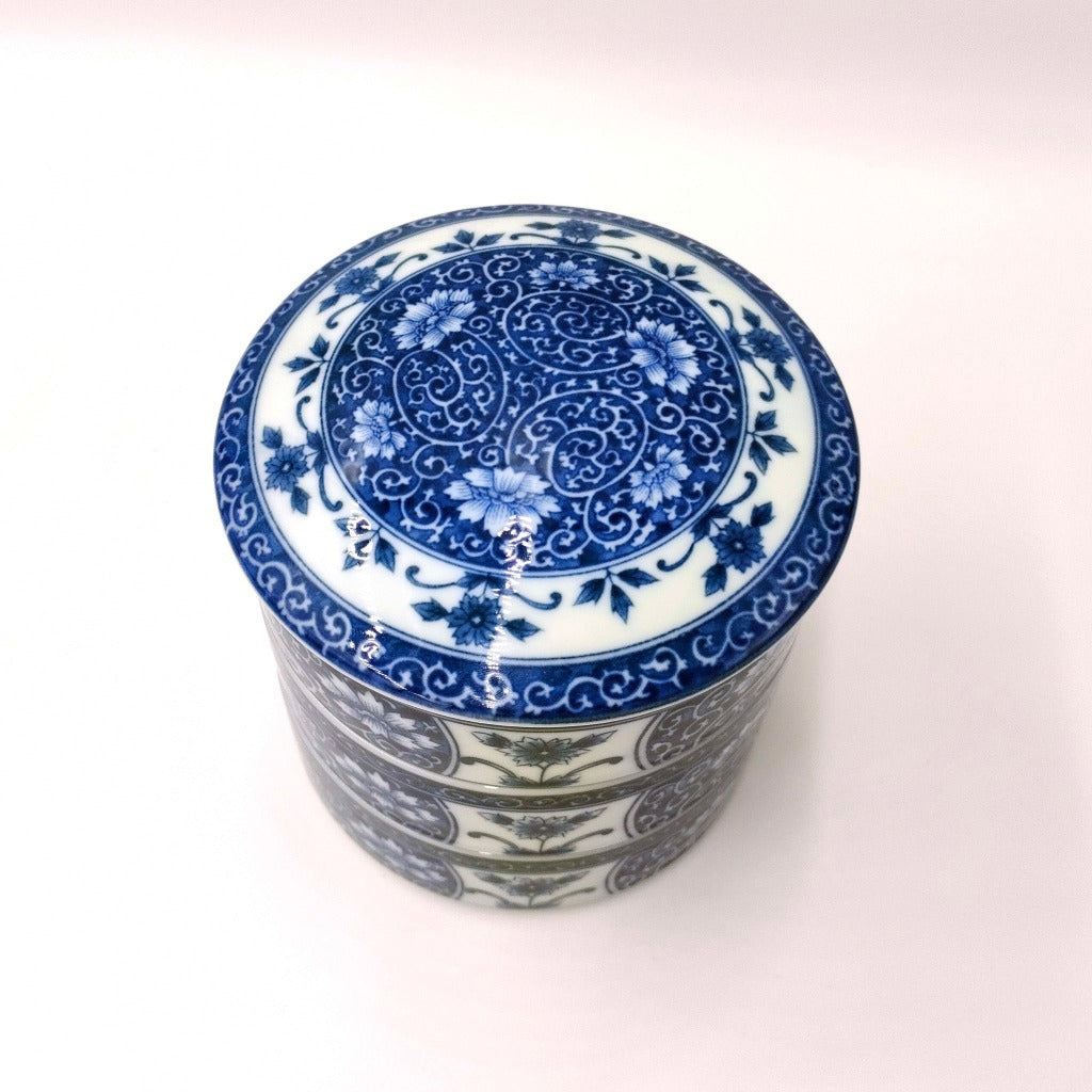 view of blue ceramic Three Tiered Jūbako displaying intricate floral pattern from above