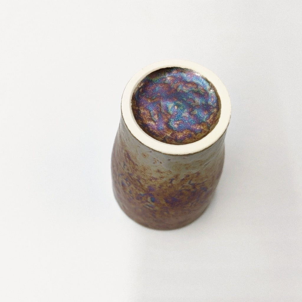 view of base of ceramic Tenmoku Cup with oil drop glaze finish