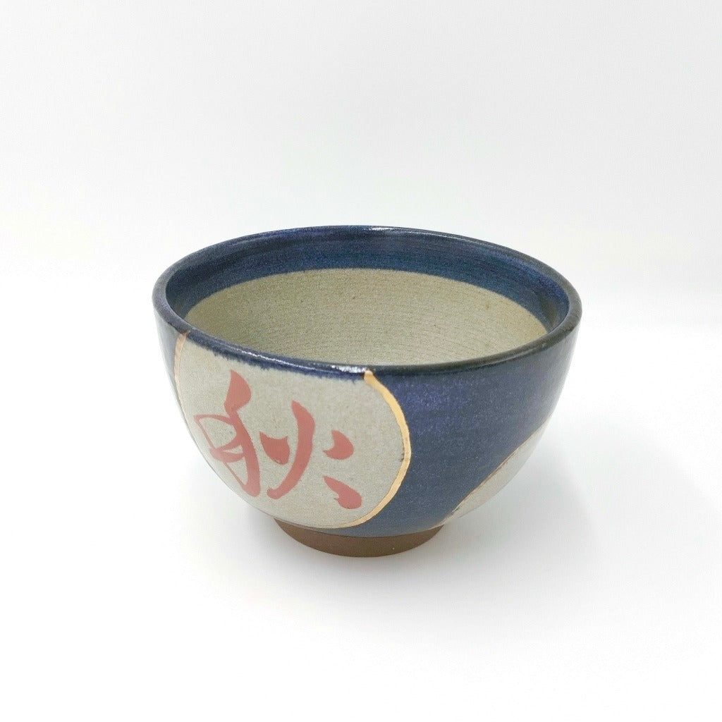 top down angled view of ceramic Shunka-Shuto Donburi bowl showing red chinese character