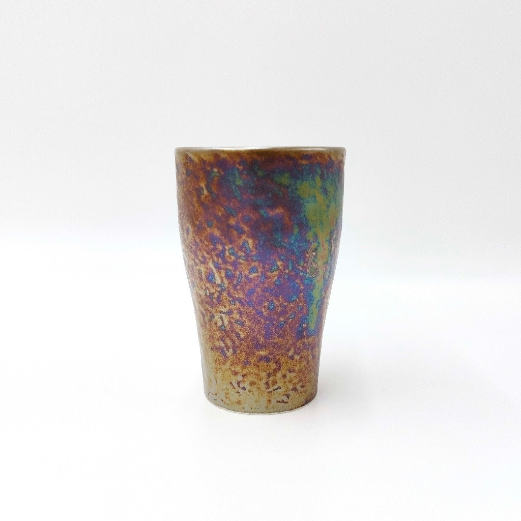 side view of ceramic Tenmoku Cup with oil drop glaze finish