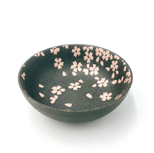 Sakura themed side bowl. Top down angled view of black bowl with pink sakura petals decorating the inside of the bowl.