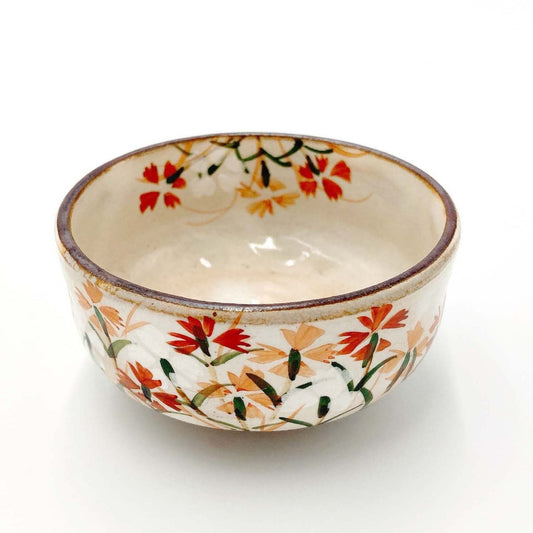 Angled view of Shunzan Mori Nadeshko Sake Cup decorated with caryophyllaceae flowers.